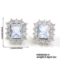 Square light blue zircon earrings with surrounding crystals and silver metal base - White K Silver