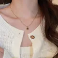 Golden twist chain necklace with a dark tiger eye gemstone pendant worn on neck - 7# Gold Style