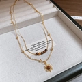 Double-layered gold necklace with brown tiger eye beads and sun pendant on jewelry tray - 28# Gold Brown Style