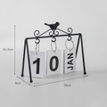 Modern black metal flip calendar with decorative bird and white date cards - Metal Bird Style / Black