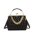 Detail of black quilted leather crossbody bag featuring gold metal frame and thick chain - Black