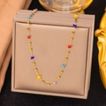 Detail of gold titanium chain with colorful beads on a premium brown jewelry display box - Colorful Crystal Chain Necklace (H1013) / Gold