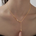 Minimalist 18K gold plated titanium necklace with star motifs and gold bead pendant - Star Tassel (H6134) Gold
