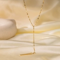 Minimalist Y-shaped golden stainless steel tassel necklace on silk background - Lip Long Bar (H1028) Gold