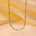 Gold-plated snake bone chain necklace with turquoise blue oval accents on silk - Blue Bead Blade Chain (H1058) Gold