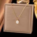 18K gold plated titanium necklace with oval white gemstone pendant on display box - White Cat's Eye Stone (H1009) Gold