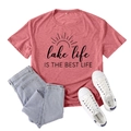 Women's red Lake Life graphic tee paired with blue jeans and white canvas shoes - S / Rose Gold
