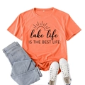 Vibrant orange Lake Life graphic t-shirt paired with jeans on a clean white background - S / Orange