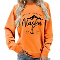 Bright orange Alaska Cruisin graphic sweatshirt with ribbed crew neck for women - S / Ginger Yellow (Black Font) (11910)
