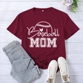 Burgundy Baseball Mom printed T-shirt paired with jeans on a white wood background - Burgundy