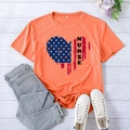 Orange summer nurse heart American flag print t-shirt in casual flat lay styling - S / Orange (Black Font)