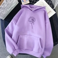Lavender oversized hoodie with minimalist floral print on a stylish flat lay background - Purple