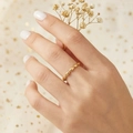 Close-up of a gold rice grain ring made of polished 18k plated stainless steel - US 5 / Gold