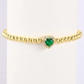Detail of gold beaded bracelet featuring a green heart gemstone surrounded by white zircons - May-Emerald Green (Style 05)