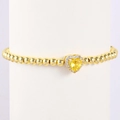 Detail of gold heart charm with yellow zircon and pavé crystals on a beaded bracelet - October-Tourmaline Pink (Style 10)