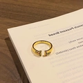 Detail of adjustable gold ring with ribbed texture and red-green Christmas tree motif - Style 9 Adjustable Ring