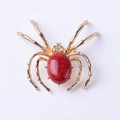 Spilla a ragno dorata con pietra ovale rossa e occhi in strass verdi per accessori DIY - Rosso