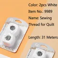 White sewing thread set with two 31-meter rolls and assorted needles in blister pack - 2 White Quilt Threads and Needle Set