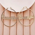 Golden hoop earrings featuring beautiful cutout letters and textured dot finish - Gold Large Hoop with Hollow "Beautiful" Letters