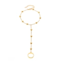Polished gold finger bracelet with heart charms featuring an integrated hand chain and ring - Gold Heart One-Finger