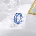 Macro detail of a light blue enamel chain ring with an adjustable open band design - Adjustable Open / Light Blue