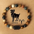 Aries zodiac beaded bracelet featuring tiger eye and lapis style stones on paper - Aries