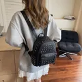Mini black PU leather backpack with silver rivets and adjustable straps for women - Black