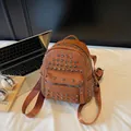 Brown faux leather backpack with silver studs and caramel pebble texture finish - Brown