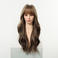 Front view of long wavy blonde wig with bangs on a mannequin over a white display stand - Dark Brown