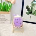 Detail of cute purple grape bubble tea plush toy with embroidery on mini wooden chair - 11cm / Purple Squint Eyes