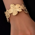 Detailed view of golden 3D floral cuff bracelet with textured radial brushed petals - 3D Brushed Petals (bk021-KC)