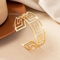 Detail of gold wide cuff bracelet featuring Greek meander cut-outs and mirror finish - Greek Meander Hollow Style (bk022-KC)
