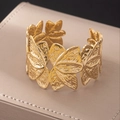 Macro detail of gold textured cuff bracelet with overlapping leaf patterns on a jewelry box - Overlapping Leaves Natural Texture (bk024-KC)