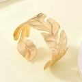 Detail of golden open cuff bracelet with lifelike leaf texture and metallic finish - Bionic Large Leaf Style (bk025-KC)