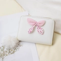 Mini portamonete in ecopelle bianca con fiocco rosa a pois e chiusura lampo dorata - Bianco