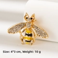 Detailed macro view of a 4x3cm gold-tone honey bee brooch with rhinestones and enamel - Golden Bee (BR2399)