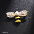 Detail shot of a small bee brooch with dimensions 4cm by 2.5cm on a black background - Yellow Black Bee (BR2403)