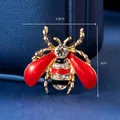 Macro shot of a bee brooch with red oil drop wings and crystals, size 2.8x3cm - Red Insect (XD5709-2)