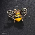 Macro detail of bee enamel brooch showing dimensions 2.1cm by 1.4cm and 3g weight - Yellow Bee (XD8869-1)