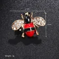 Macro shot of bee brooch with red enamel and crystals, 2.1cm x 1.4cm size detail - Red Black Bee (XD8870-1)