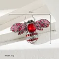 Detail of honeybee brooch featuring red crystals and intricate rhinestone wing patterns - Antique Silver Red Bee (XD10984-1)