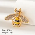 Golden honey bee brooch with white crystals and yellow enamel detail, size 4x3cm - Golden Bee (BR2399)