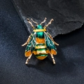 Chic bee brooch in gold metal with vibrant green and yellow enamel on a dark background - Blue Yellow Bee (XD825457-1)