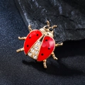 Cute ladybug brooch with red enamel wings and crystal rhinestones on gold base - Six-Star Beetle (XD825275)