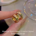 Golden wide hoop earrings with star-set colorful gemstones in a vintage style - E6851 Gold