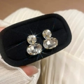 Elegant gold earrings with round and oval cut crystals in a black velvet jewelry box - E6973 Gold