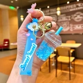 Close-up of heart-themed blue bubble tea keychain with liquid quicksand and gold charms - Blue Luminous Bubble Bead Frappe Cup