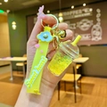 Detail of yellow milk tea liquid quicksand keychain with sweet heart strap and star sequins - Yellow Luminous Bubble Bead Frappe Cup
