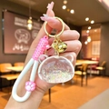 Süßer Bär-Schlüsselanhänger mit rosa Katzenpfote und glitzerndem Treibsand-Anhänger - Leuchtende Luftblasenperle Bärenkopf / Weiß