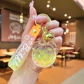 Dettaglio del portachiavi con sabbie mobili gialle, campanellino e cinturino Bubble - Imballaggio in Sacchetto OPP Indipendente / Giallo